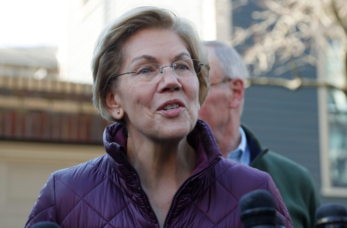 Senator Elizabeth Warren talks to reporters after telling her staff she is withdrawing from 2020 U.S. presidential race outside her home in Cambridge, Massachusetts