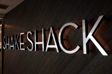 FILE PHOTO: A logo stands outside of a Shake Shack store in New York