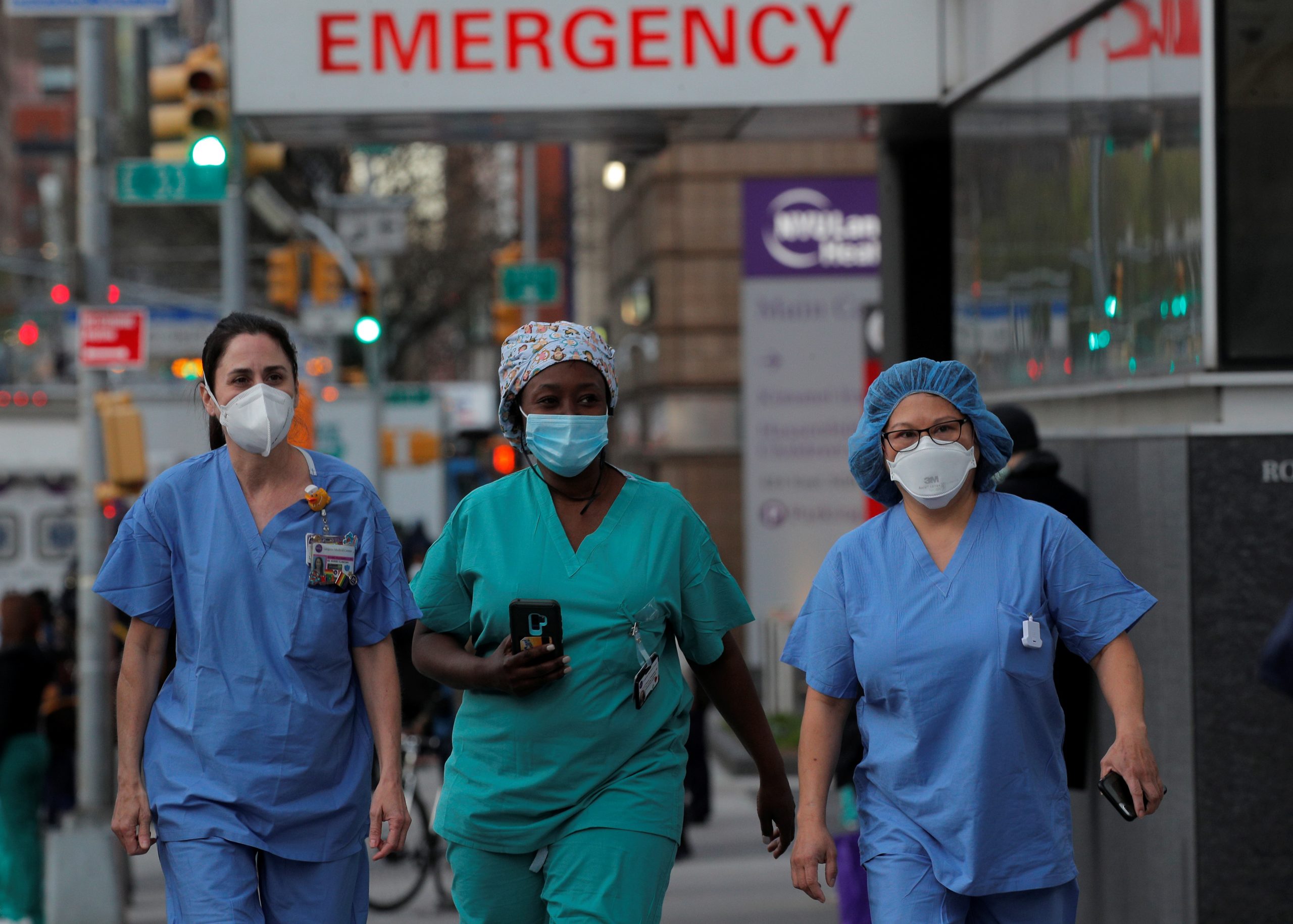 Healthcare workers walk outside NYU Langone Medical Center after people came to cheer and thank them during outbreak of coronavirus disease (COVID-19) in New York