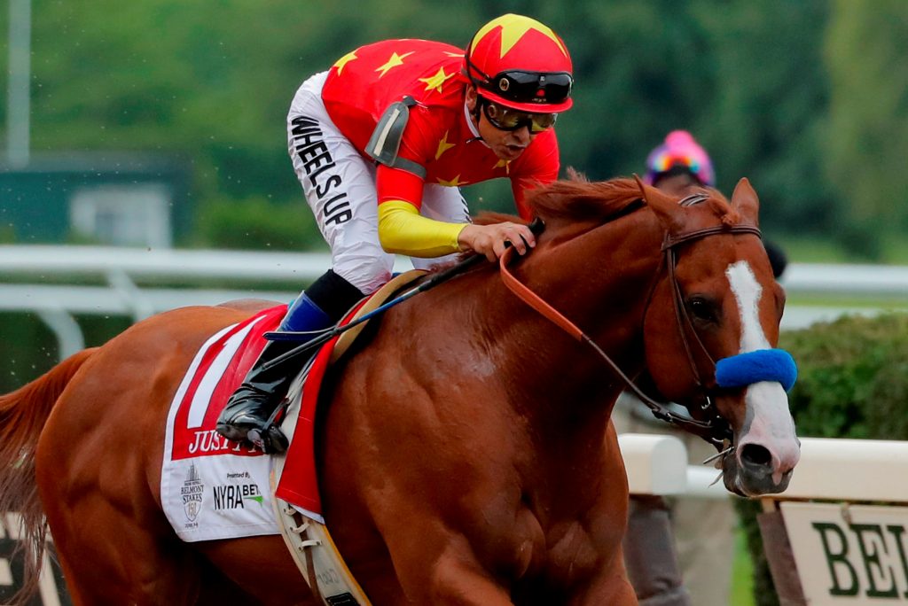 FILE PHOTO: Justify with jockey Mike Smith aboard wins the 150th running of the Belmont Stakes at Belmont Park in Elmont