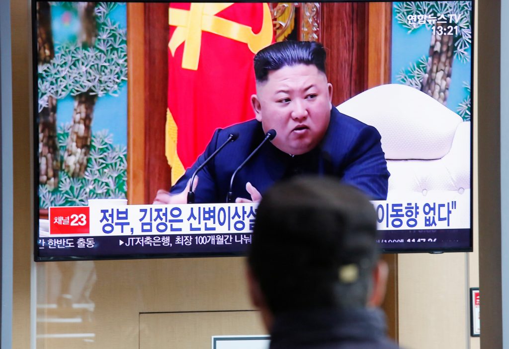 South Korean people watch a TV broadcasting a news report on North Korean leader Kim Jong Un in Seoul