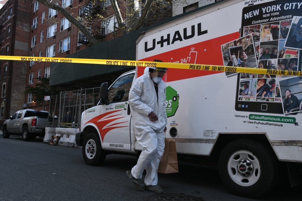 Man in custody after woman was found wrapped in tarp and dumped on