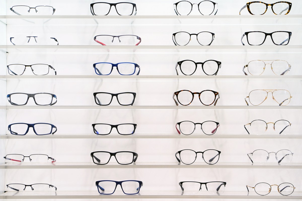 Stand with glasses in the store of optics.