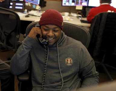 Singer Jadakiss executes a trade on the CIBC trading floor during the company’s Miracle Day charity event in New York