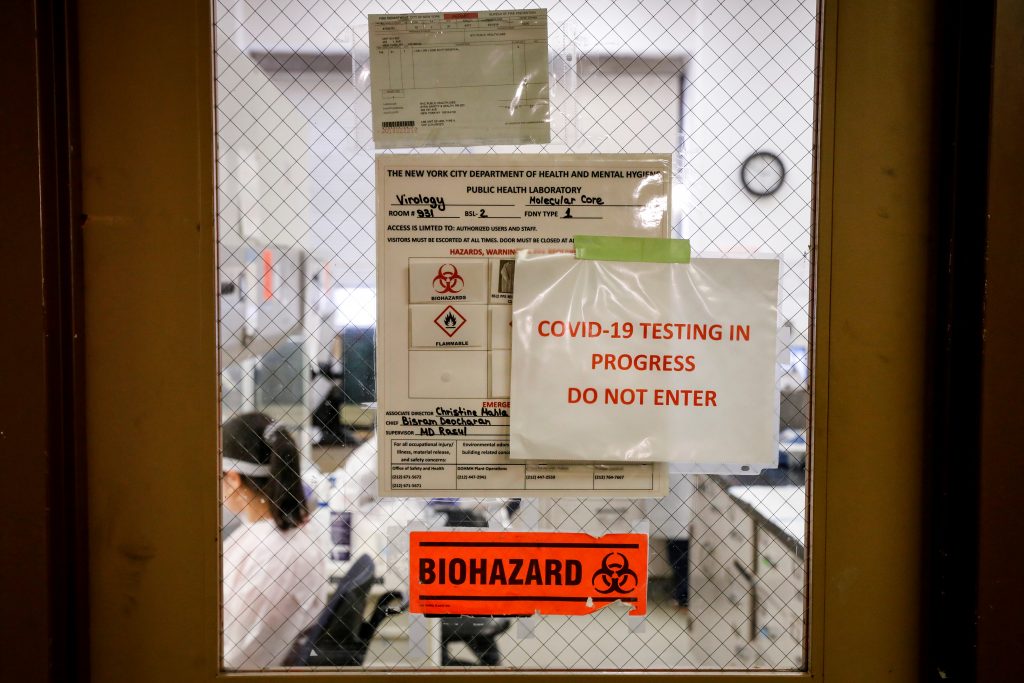Scientists work in a lab testing COVID-19 samples at New York City’s health department, during the outbreak of the coronavirus disease (COVID-19) in New York