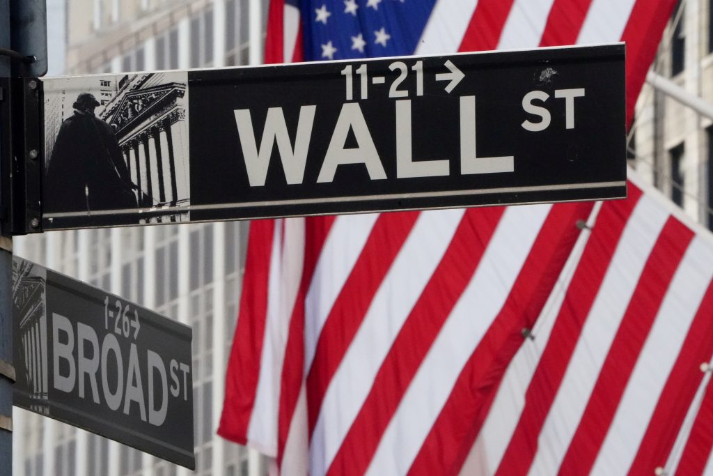 FILE PHOTO: The Wall Street sign is pictured at the New York Stock exchange (NYSE) in the Manhattan borough of New York City