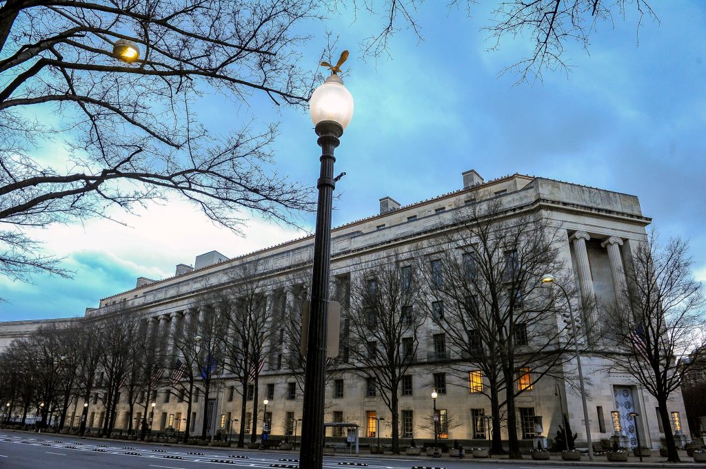 FILE PHOTO: The U.S. Department of Justice building is bathed in morning light at sunrise in Washington