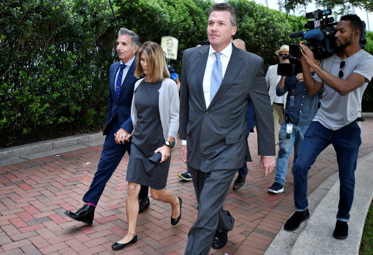 FILE PHOTO:  Actress Lori Loughlin and her husband fashion designer Mossimo Giannulli arrive at the federal courthouse in Boston