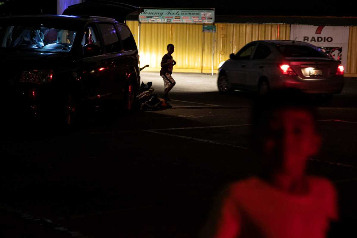 People enjoy movies at a drive-in theatre while keeping social distancing following the outbreak of the coronavirus disease in Fort Lauderdale