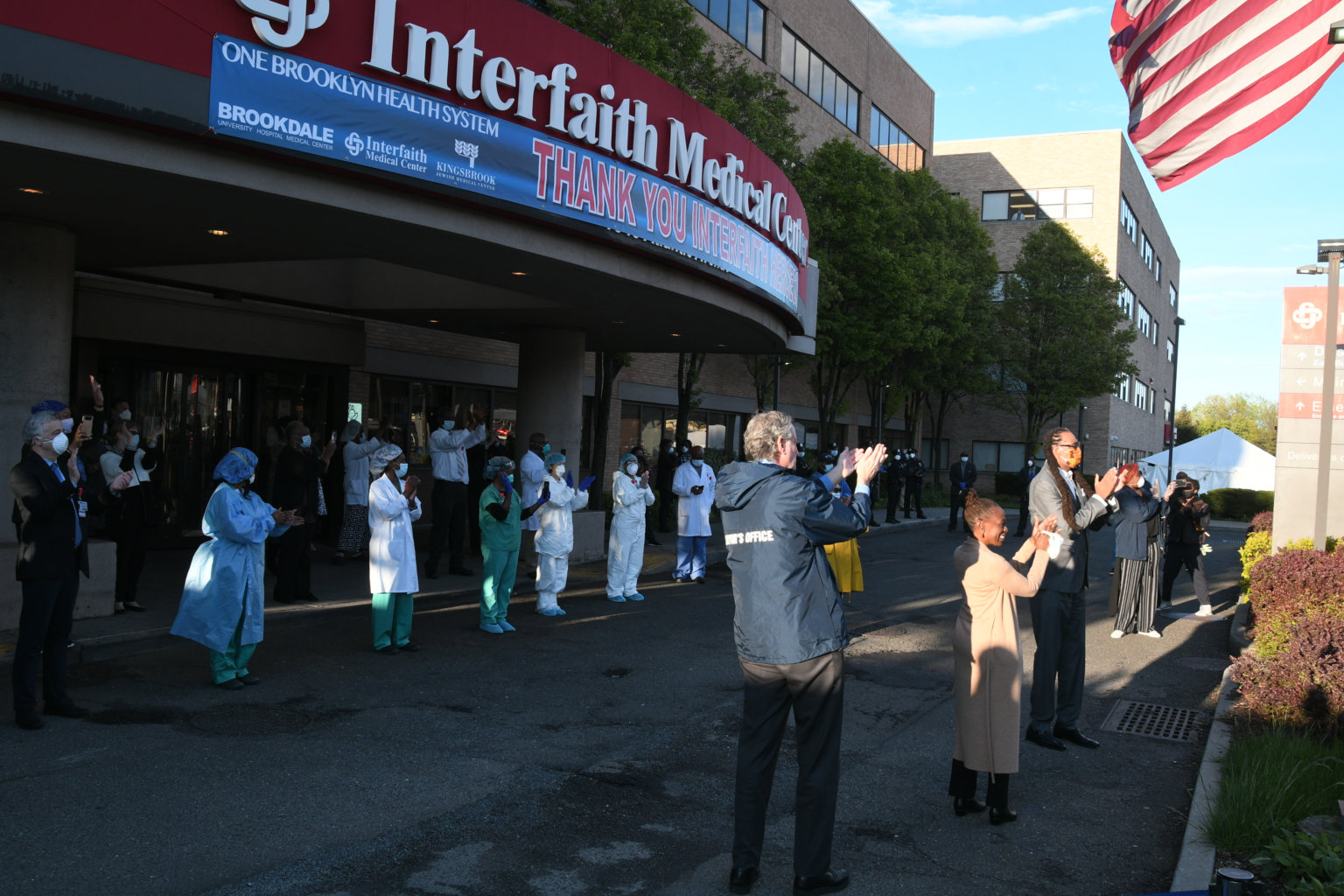 Nurses at Interfaith Medical Center clap at 7 p.m.