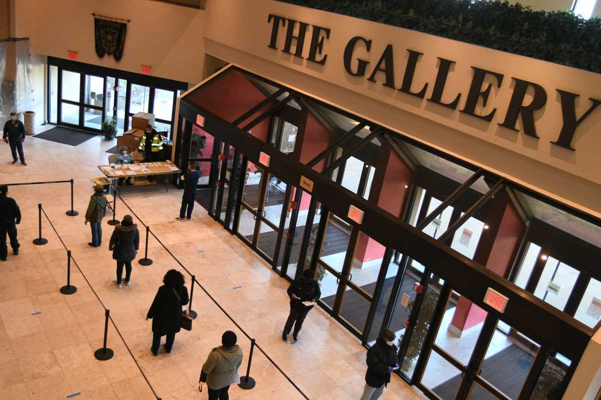 People line up inside  of Christian Cultural Center in prepation