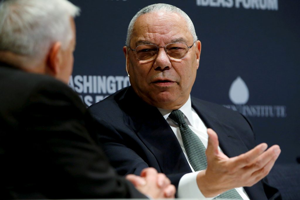 FILE PHOTO: Former U.S. Secretary of State Powell takes part in an onstage interview with Aspen Institute President and CEO Isaacson at the Washington Ideas Forum in Washington