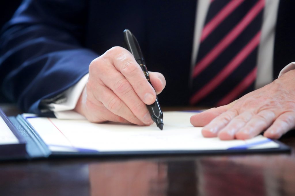 FILE PHOTO: U.S. President Trump signs the Paycheck Protection Program and Health Care Enhancement Act response to the coronavirus disease outbreak at the White House in Washington