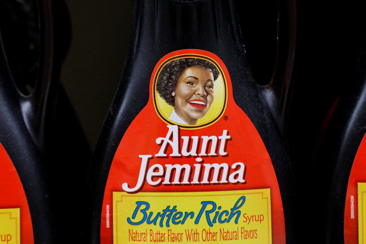 Bottles of Aunt Jemima branded syrup stand on a store shelf inside of a shop in the Brooklyn borough of New York City