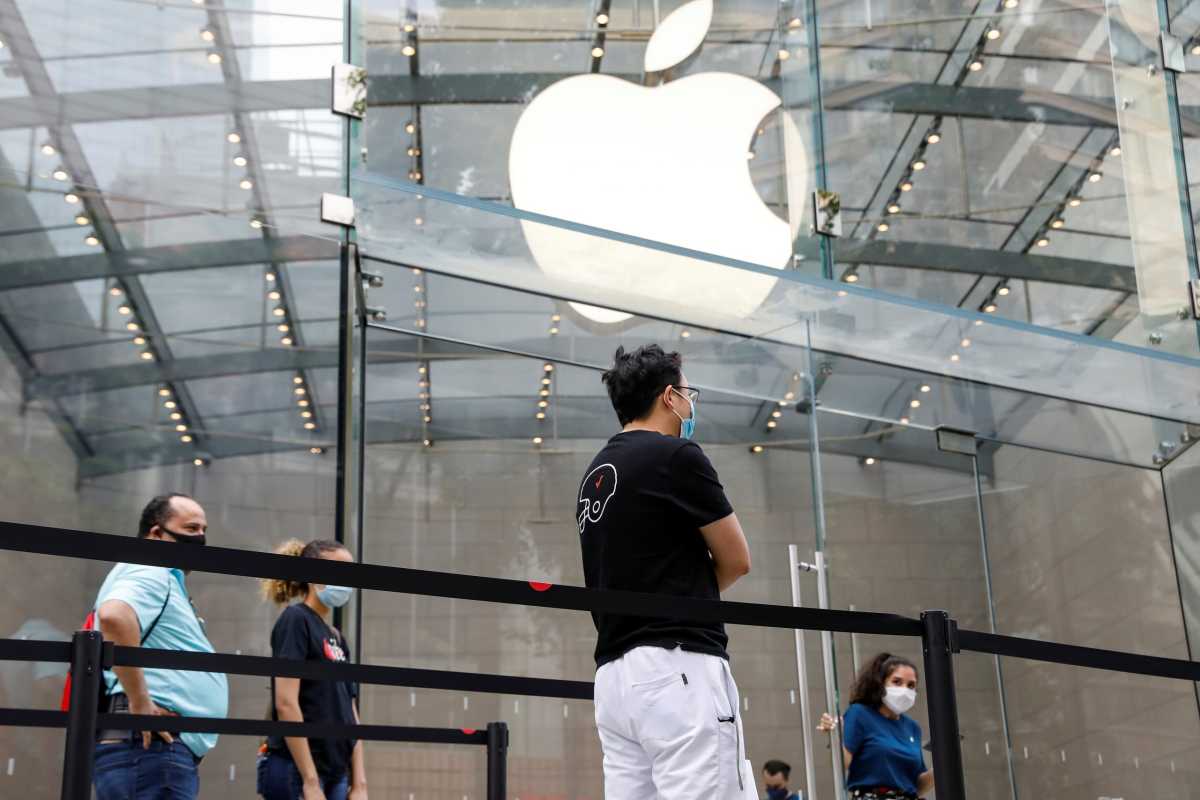 Customers distance before entering an Apple Store during phase one of reopening after COVID-19 lockdown in New York City