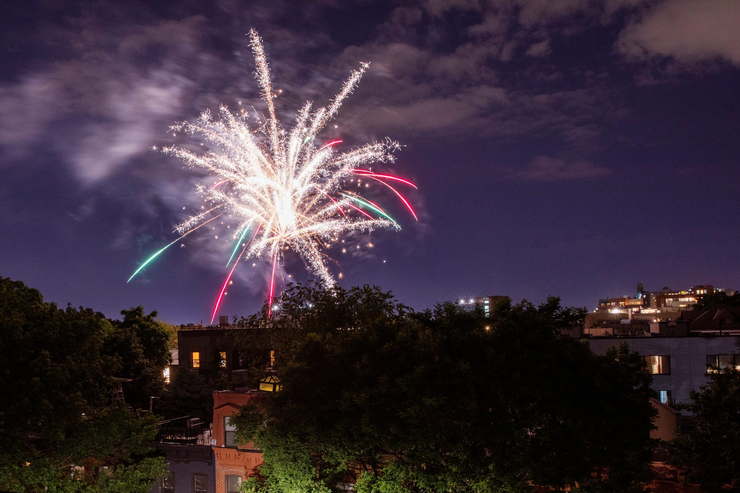 Illegal fireworks illuminate the sky over the Bedford-Stuyvesant neighborhood of the Brooklyn borough of New York City