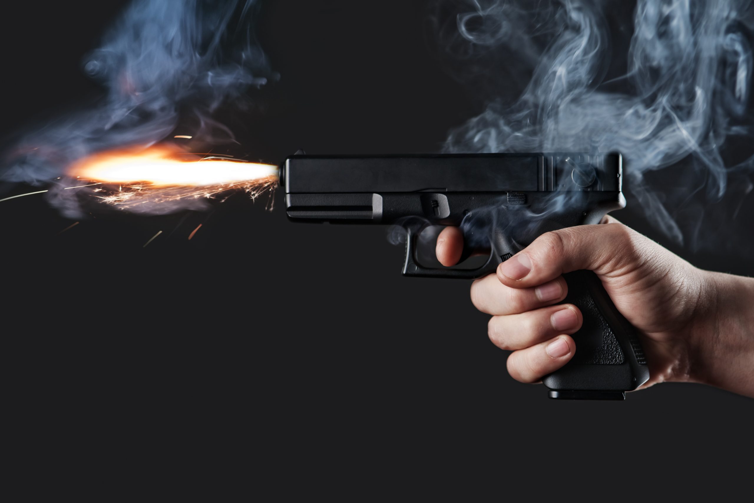 Handgun firing with fire and smoke