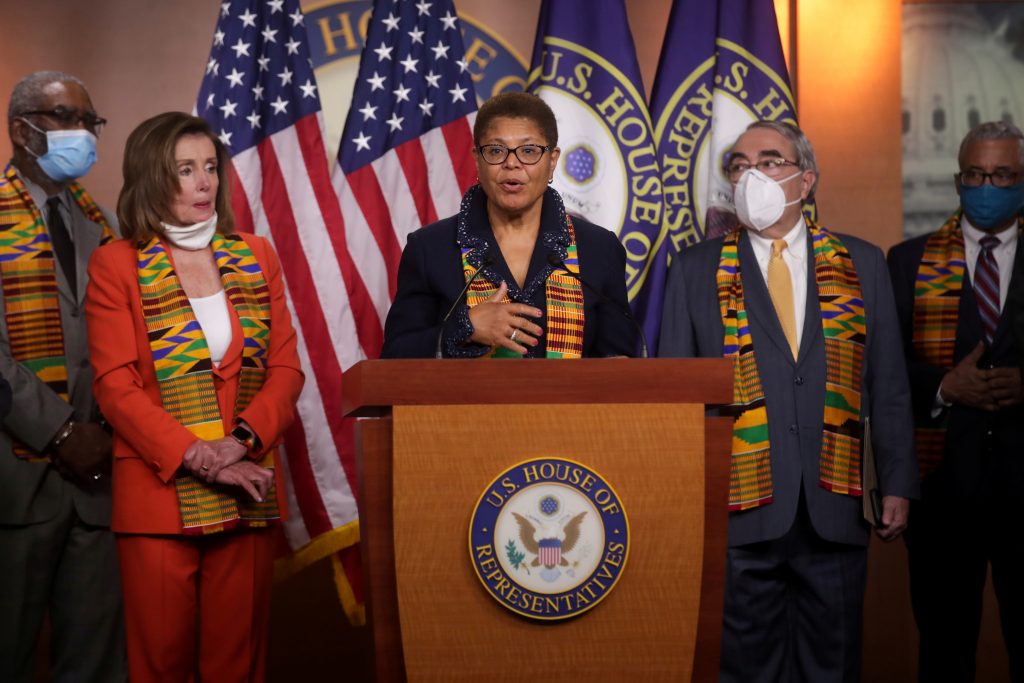 Congressional Black Caucus Chairwoman Representative Bass, flanked by House Speaker Pelosi, addresses reporters during a news conference to unveil police reform and racial injustice legislation at the U.S. Capitol in Washington