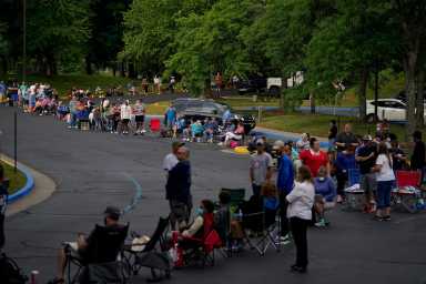 People  wait outside Kentucky Career Center in Frankfort