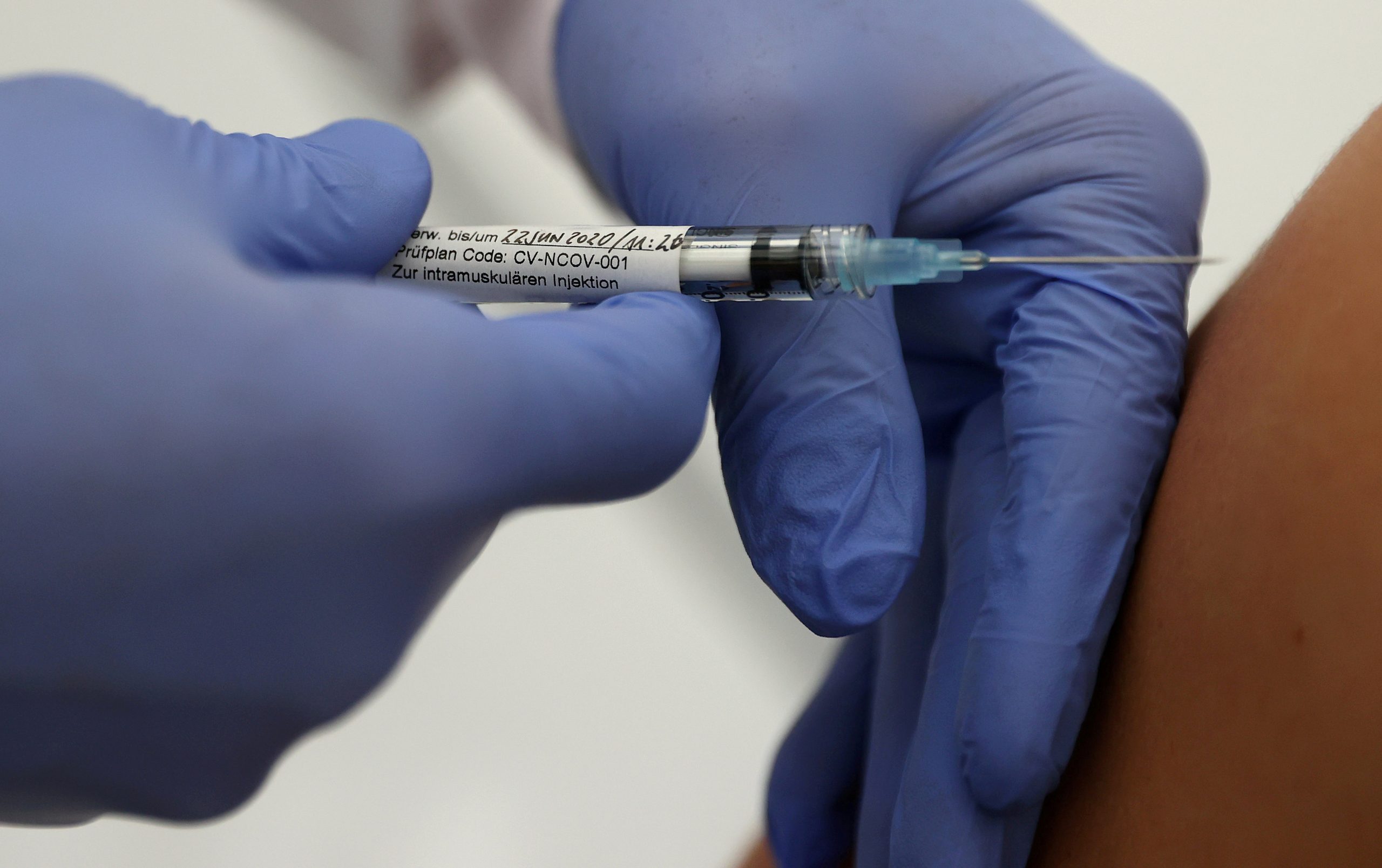 FILE PHOTO: Professor Gottfried Kremsner injects a vaccination against the coronavirus disease (COVID-19) from German biotechnology company CureVac