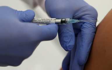 FILE PHOTO: Professor Gottfried Kremsner injects a vaccination against the coronavirus disease (COVID-19) from German biotechnology company CureVac