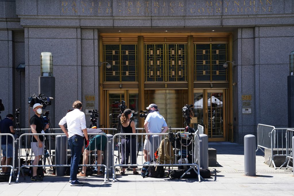 Media wait outside federal court for a bail hearing in the Ghislaine Maxwell case in the Manhattan borough of New York City