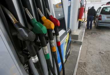 Pump nozzles are pictured at a gas station in Algiers