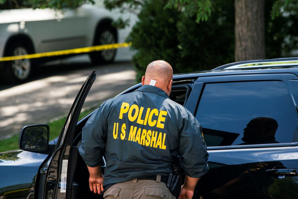 A law enforcement official is seen outside the home of federal judge Esther Salas, in North Brunswick, New Jersey