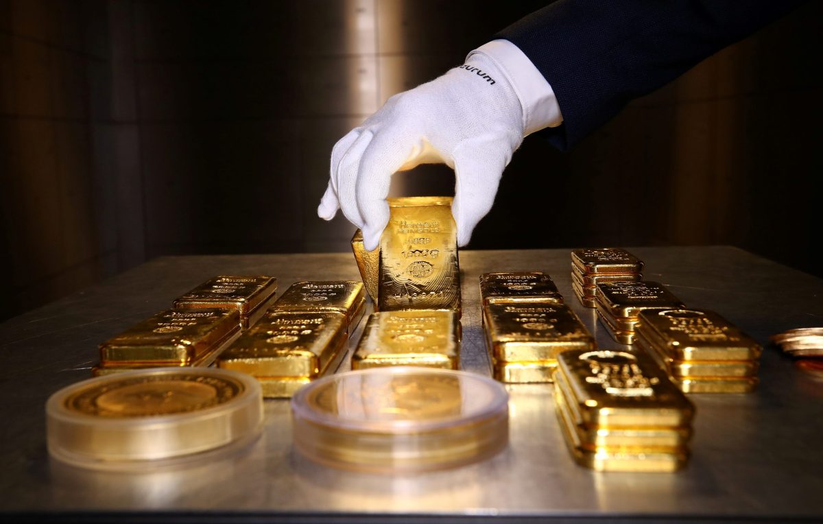 FILE PHOTO: Gold bars and coins are stacked in the safe deposit boxes room of the Pro Aurum gold house in Munich