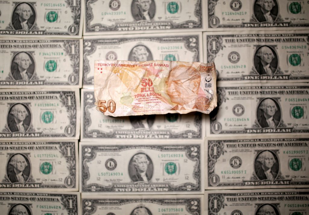 Turkish Lira and Dollar banknotes are seen in this picture illustration