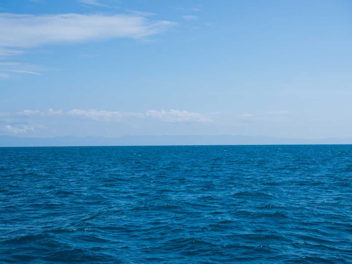 Landscape of sea horizon seascape under blue sky.