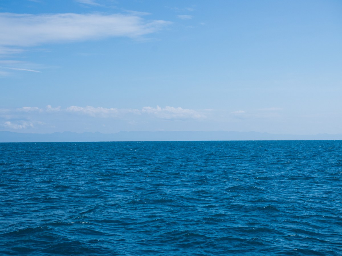 Landscape of sea horizon seascape under blue sky.