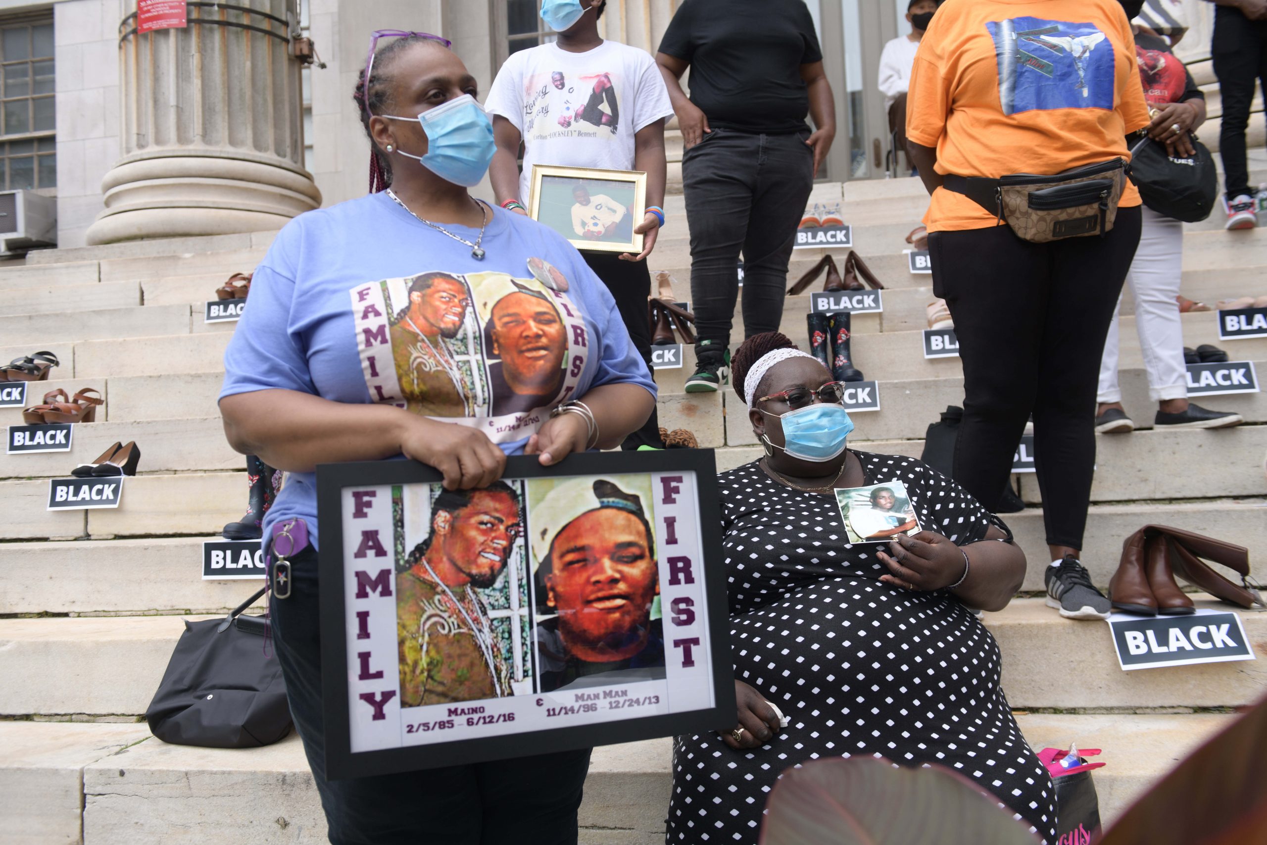 Empty shoes lined up on Brooklyn Borough Hall steps to represent 101 shooting victims of color 4