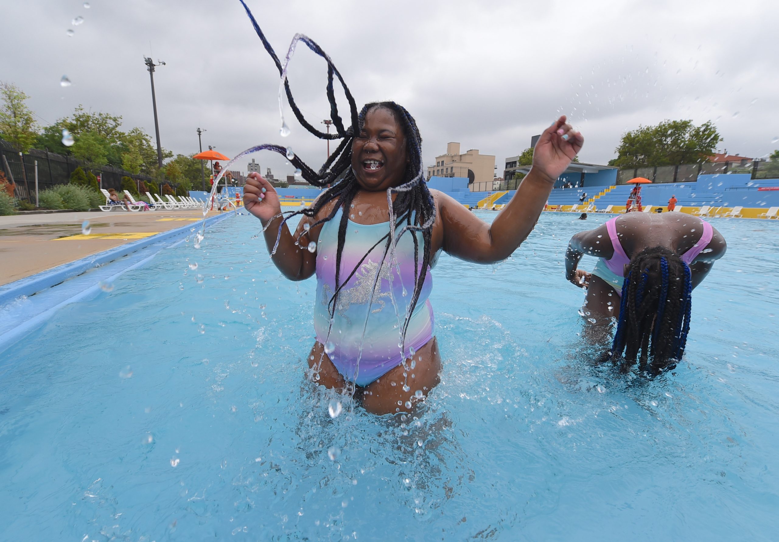 Members of the Gordon family cool down in the pool