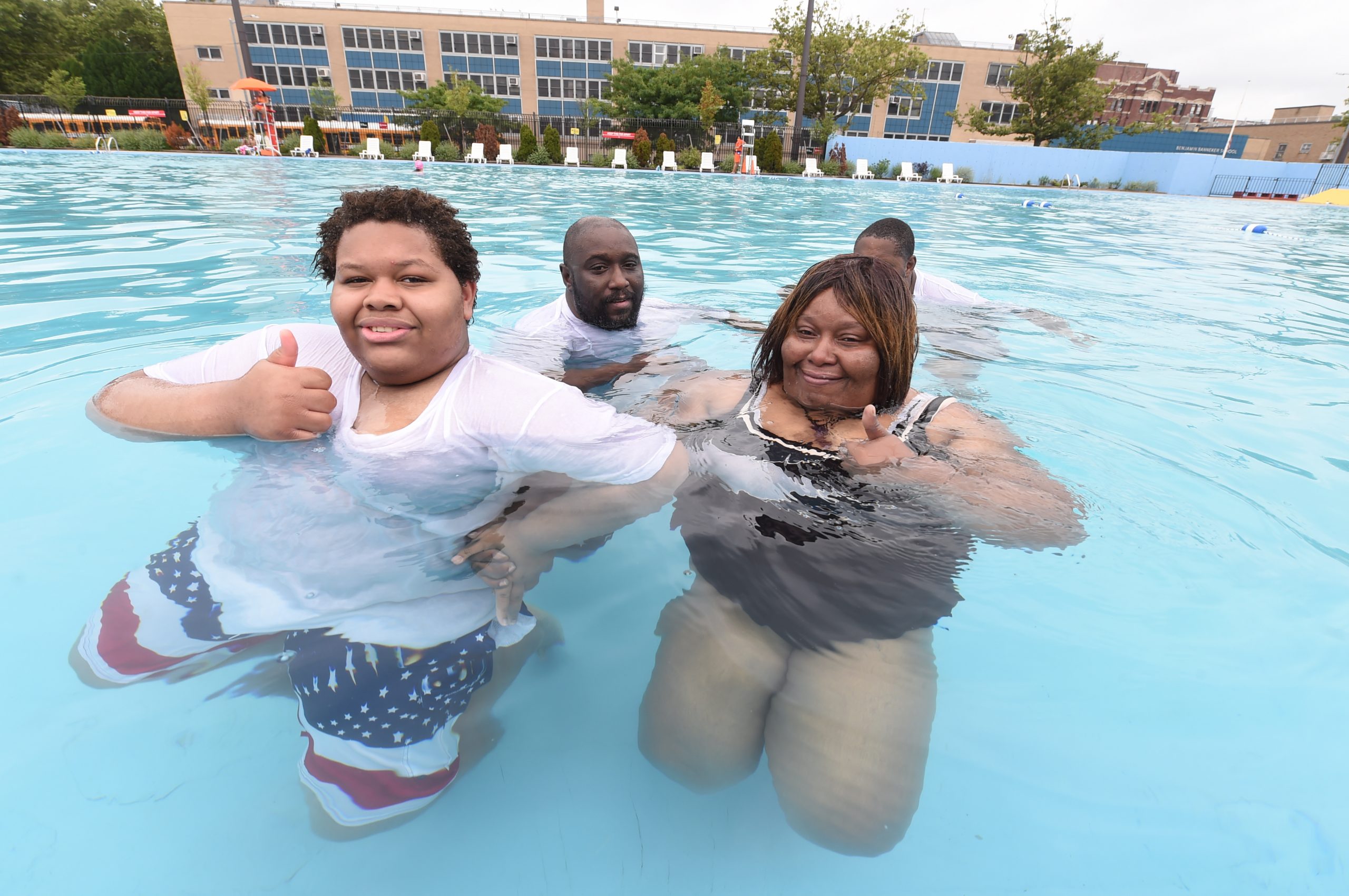 The Murray family enjoy the cool water in a very uncrowded pool.