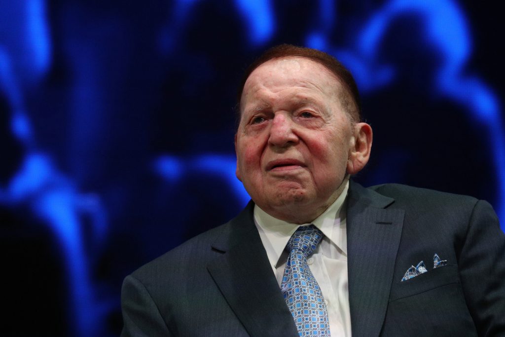 Sheldon Adelson sits onstage before a speech by U.S. President Trump at the Israeli American Council National Summit in Hollywood, Florida
