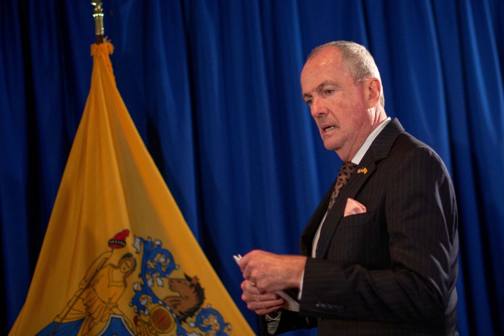 FILE PHOTO: New Jersey Governor Phil Murphy arrives to speak about electronic smoking products during a news conference in Trenton, New Jersey