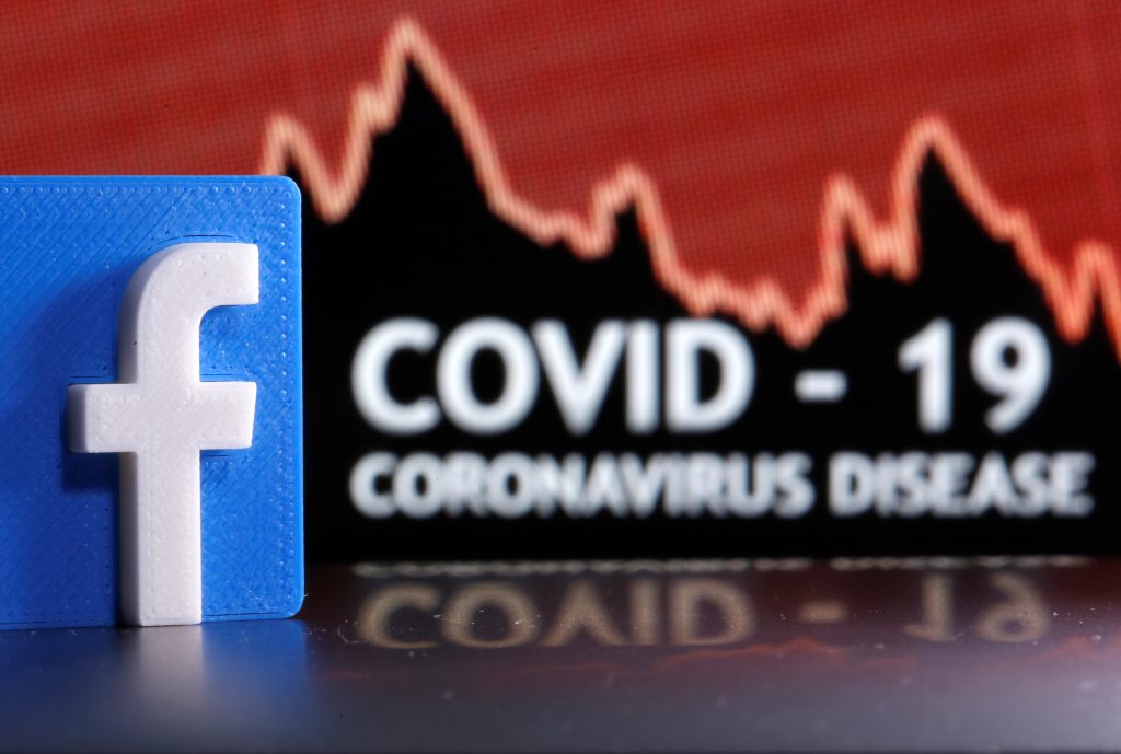 A 3D printed Facebook logo is seen in front of displayed coronavirus disease (COVID-19) words in this illustration