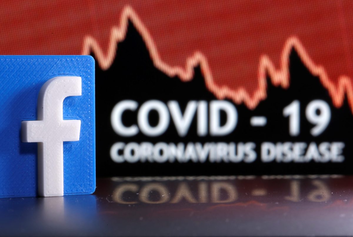A 3D printed Facebook logo is seen in front of displayed coronavirus disease (COVID-19) words in this illustration
