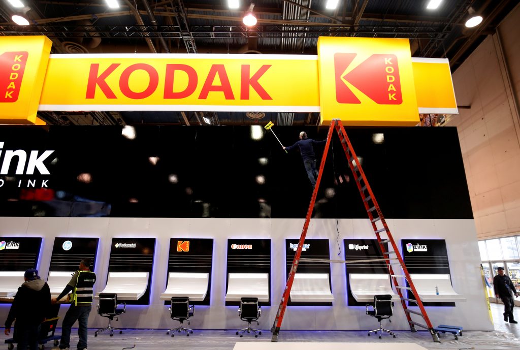 FILE PHOTO: A worker cleans a Kodak booth at the Las Vegas Convention Center in preparation for 2019 CES in Las Vegas