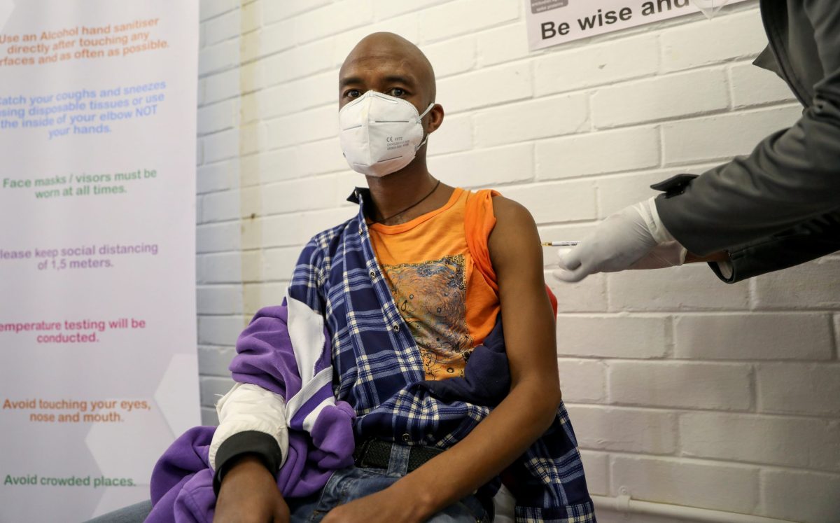 FILE PHOTO: A volunteer receives an injection from a medical worker during the country’s first human clinical trial for a potential vaccine against the novel coronavirus, in Soweto