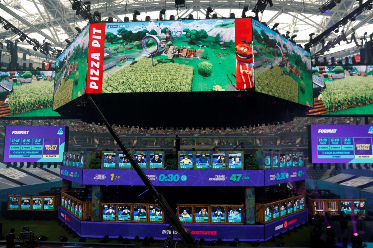 FILE PHOTO: Contestants compete during the Fortnite World Cup Duos Finals at Flushing Meadows Arthur Ashe stadium in the Queens borough of New York