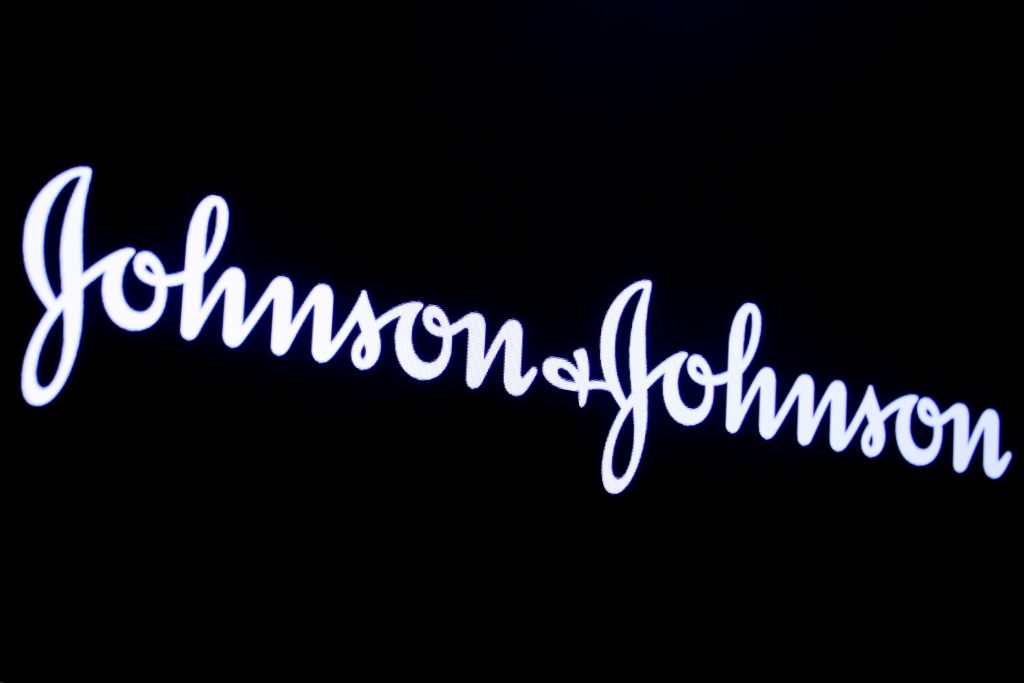 FILE PHOTO: The company logo for Johnson & Johnson is displayed on a screen to celebrate the 75th anniversary of the company’s listing at the NYSE in New York