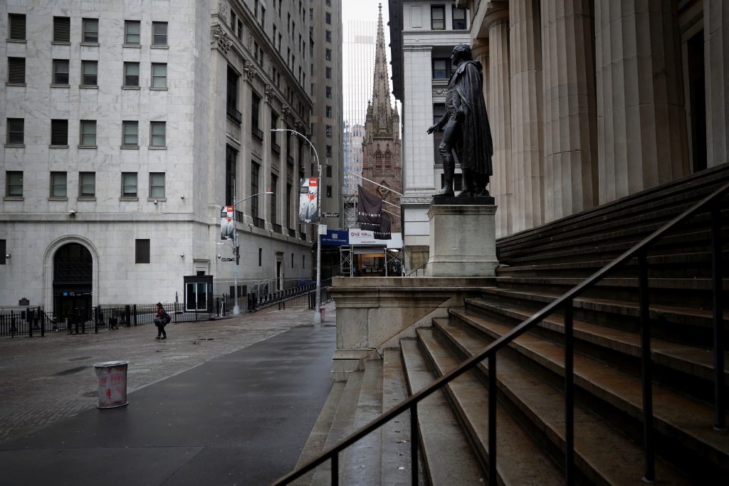 Nearly deserted Wall Street and steps of Federal Hall in lower Manhattan during outbreak of coronavirus disease (COVID-19) in New York