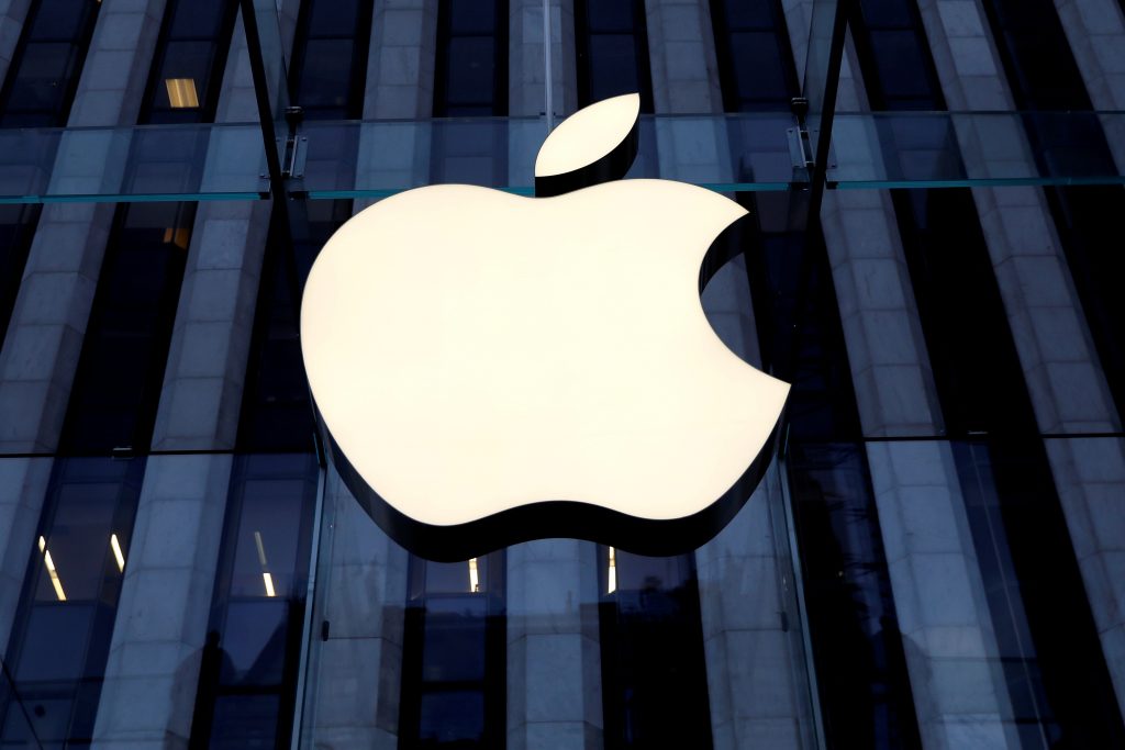 FILE PHOTO: The Apple Inc logo is seen hanging at the entrance to the Apple store on 5th Avenue in New York