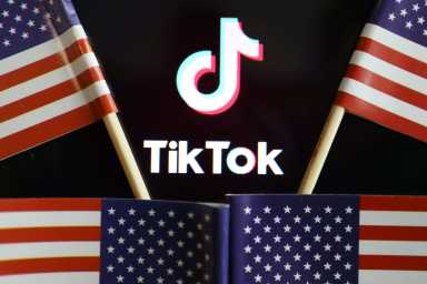 TikTok to challenge U.S. order banning transactions with the video app 32 FILE PHOTO: Illustration picture of Tiktok with U.S. flags