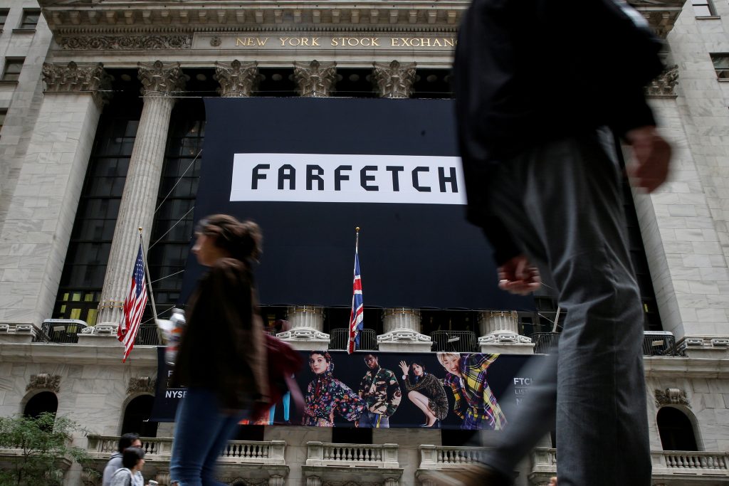 FILE PHOTO: A banner to celebrate the IPO of online fashion house Farfetch is displayed on the facade of the of the NYSE in New York