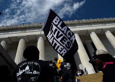 ‘Get Your Knee Off Our Necks’ march in support of racial justice, in Washington