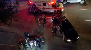 Video grab of medics and police personnel with the victim of a shooting in Portland, U.S.