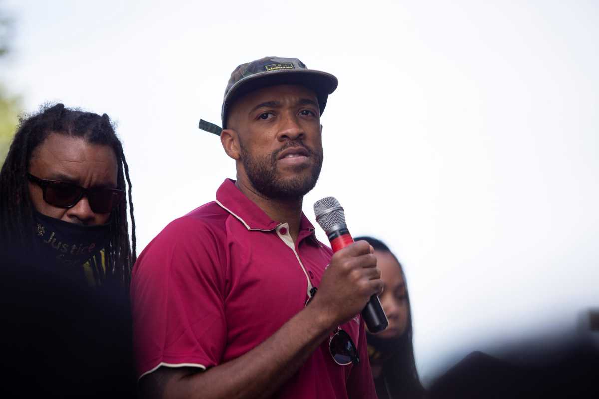 People protest after a Black man identified as Jacob Blake was shot several times by police in Kenosha